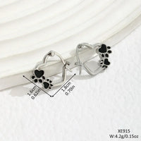 Huggie earrings with heart and black enamel