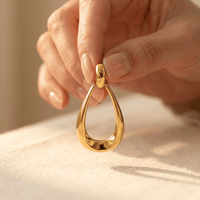 Gold Polished Teardrop Dangle Earrings